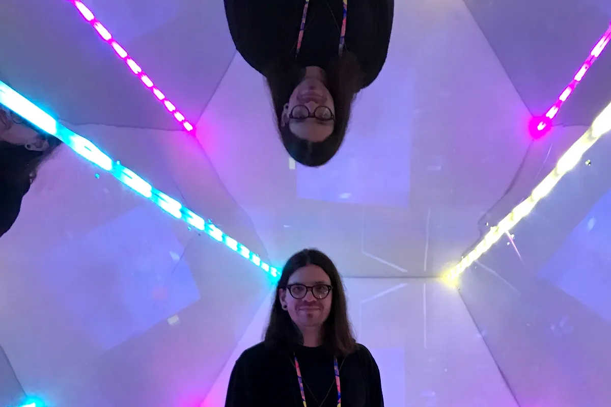 Dan Arbello standing in a mirror structure at No Code Conference